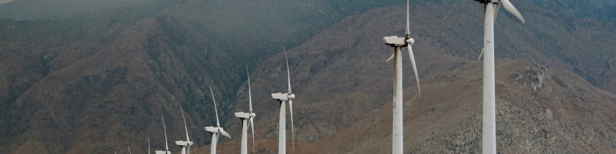 Wind turbines in the mountains Photo by Nico on Unsplash